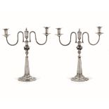 Two silver candlesticks, Germany early 1800s - Molten, embossed and chiselled silver. [...]