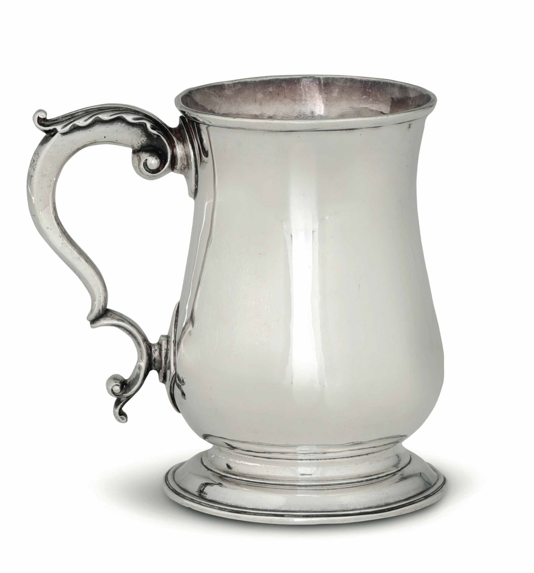 A silver tankard, London 1769 - Molten, embossed and chiselled silver. Unidentified [...]