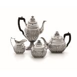 A silver tea set, Portugal 1800s - Molten, embossed and chiselled silver with [...]