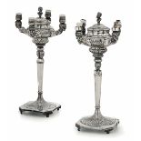 Two silver lamps, Italy, 1900s - Two molten and chiselled lamps. Weighted bases. [...]