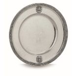A silver plate, J. Reiner, Vienna 1856 - Molten and chiselled silver. 919gr, diam 22cm -