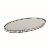 A tray, Italy, mid XX century - An oval centrepiece in silver. 50x27cm. -