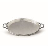 A silver tray, Milan, 1900s, I. Pradella - An oval tray in molten and perforated [...]