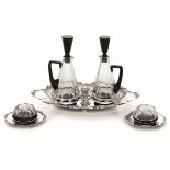 A set of silver items, Italy, 1935/45 - A set that includes a cruet stand, two small [...]