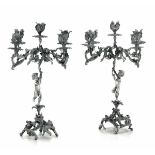 Two silver candlesticks, Italy, 1900s - Candlesticks with five flames, Molten and [...]