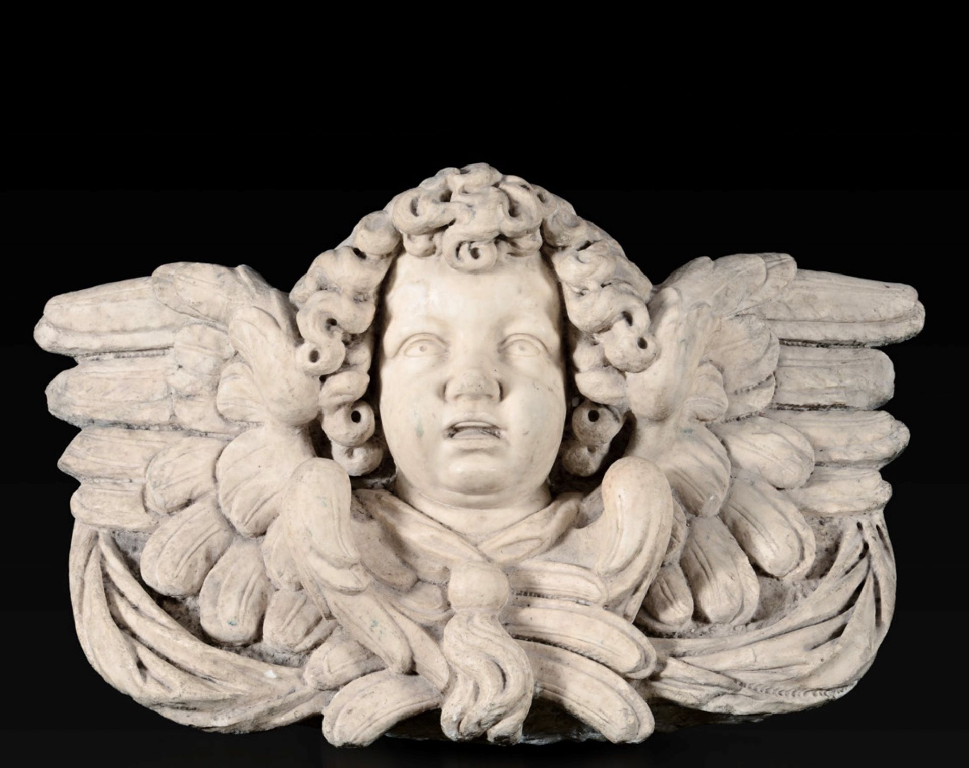 A marble cherub head, Genoa, 1600s - 93x35x60cm -