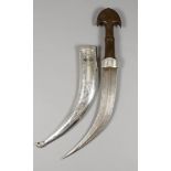 A Middle Eastern Jambiya Dagger, 20th Century, with wooden handle and silvery metal and niello