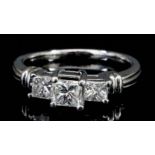 A Three Stone Diamond Ring, Modern, in platinum mount, set with three princess cut diamonds,