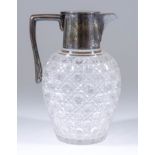 A George V Silver Mounted and Hobnail Cut Glass Claret Jug, by the Goldsmiths & Silversmiths Company