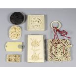 A Chinese Ivory Boxed Tangram Puzzle, 19th Century, the lid and puzzles pierced and carved with