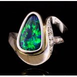 An Opal and Diamond Ring, 20th Century, in 18ct white gold mount, of abstract design, set with a