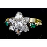 A Diamond and Emerald Flowerhead Pattern Ring, 20th Century, in gold coloured metal mount, set