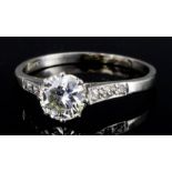 A Diamond Ring, Modern, in platinum mount, set with a central round brilliant cut solitaire,