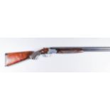 A 12 Bore Over and Under Shotgun by Franchi, Serial No. 4102607, the 27ins blued steel barrels