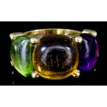 A Citrine, Peridot and Amethyst Ring, Modern, in 18ct gold mount, set with three cabochon stones,