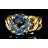 An Aquamarine Ring, Modern, in 18ct gold mount, set with a faceted circular aquamarine,