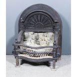 A 19th Century cast iron serpentine fronted fire grate with arched and moulded back cast with fan