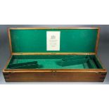 A Brass Bound Oak Gun Case, 19th Century, to hold a pair of shotguns, the interior with printed