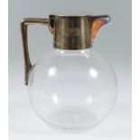 An Edward VII Silver Topped Bulbous Glass Claret Jug, by Hukin & Heath, London 1901, the plain