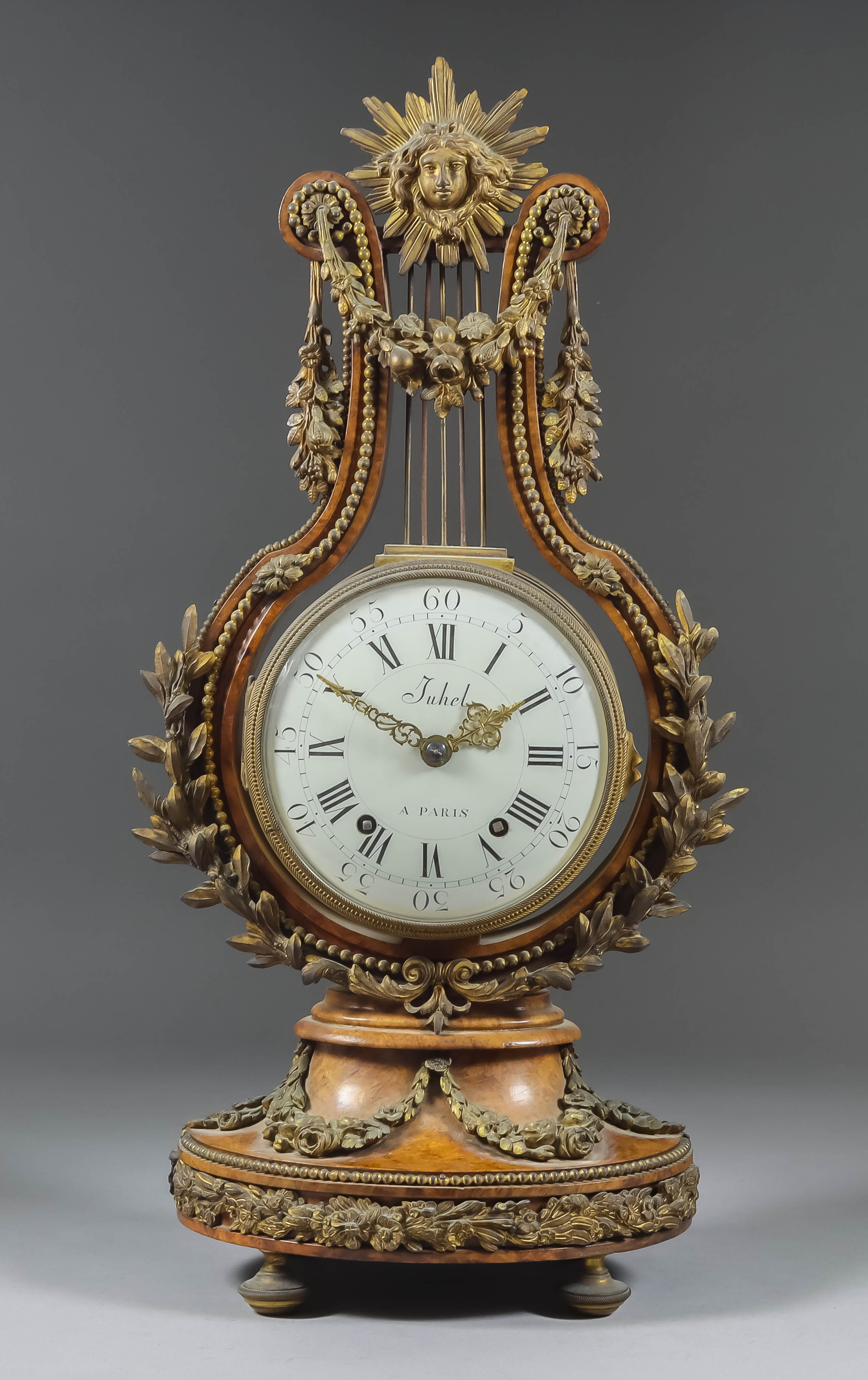 A French Burrwood and Gilt Metal Mounted Lyre Mantel Timepiece, Late 19th Century, the 5ins diameter