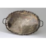 A George VI Silver Oval Two-Handled Tray, by E. Silver & Co, Sheffield 1946, the plain centre with