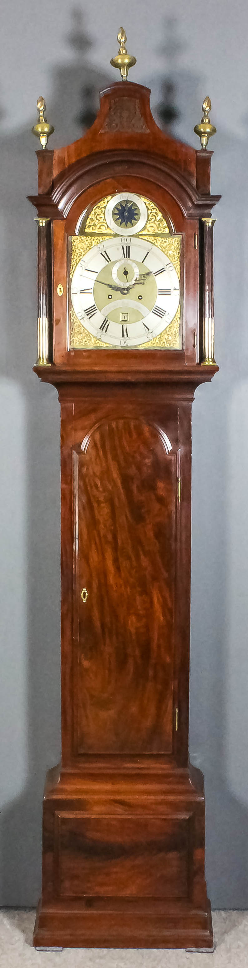 A Mahogany Longcase Clock, George III, by Joseph Lum of London, the 12ins arched brass dial with