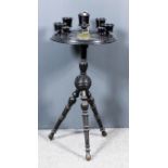 An Ebonised Circular Tripod Smoker's Companion, Victorian, the circular top with moulded edge,