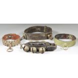 Three Leather and Brass Mounted Dog Collars, and a goat/kid leather collar hung with six crotal