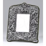 A Continental "Sterling" Silver Framed Rectangular Dressing Table Mirror, the frame with ribbon