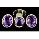 An Amethyst Ring and Pair of Matching Earrings, Modern, in 18ct gold mounts, each set with a faceted