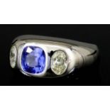 A Sapphire and Diamond Ring, Modern, in 18ct white gold mount, set with a square faceted sapphire,