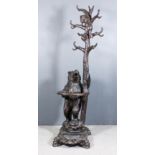 A "Black Forest" Lindenwood Hall Stand, Late 19th Century, supported by a standing figure of a