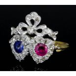 A Sapphire, Ruby and Diamond Ring, 20th Century, in 18ct gold mount, in the form of two hearts under