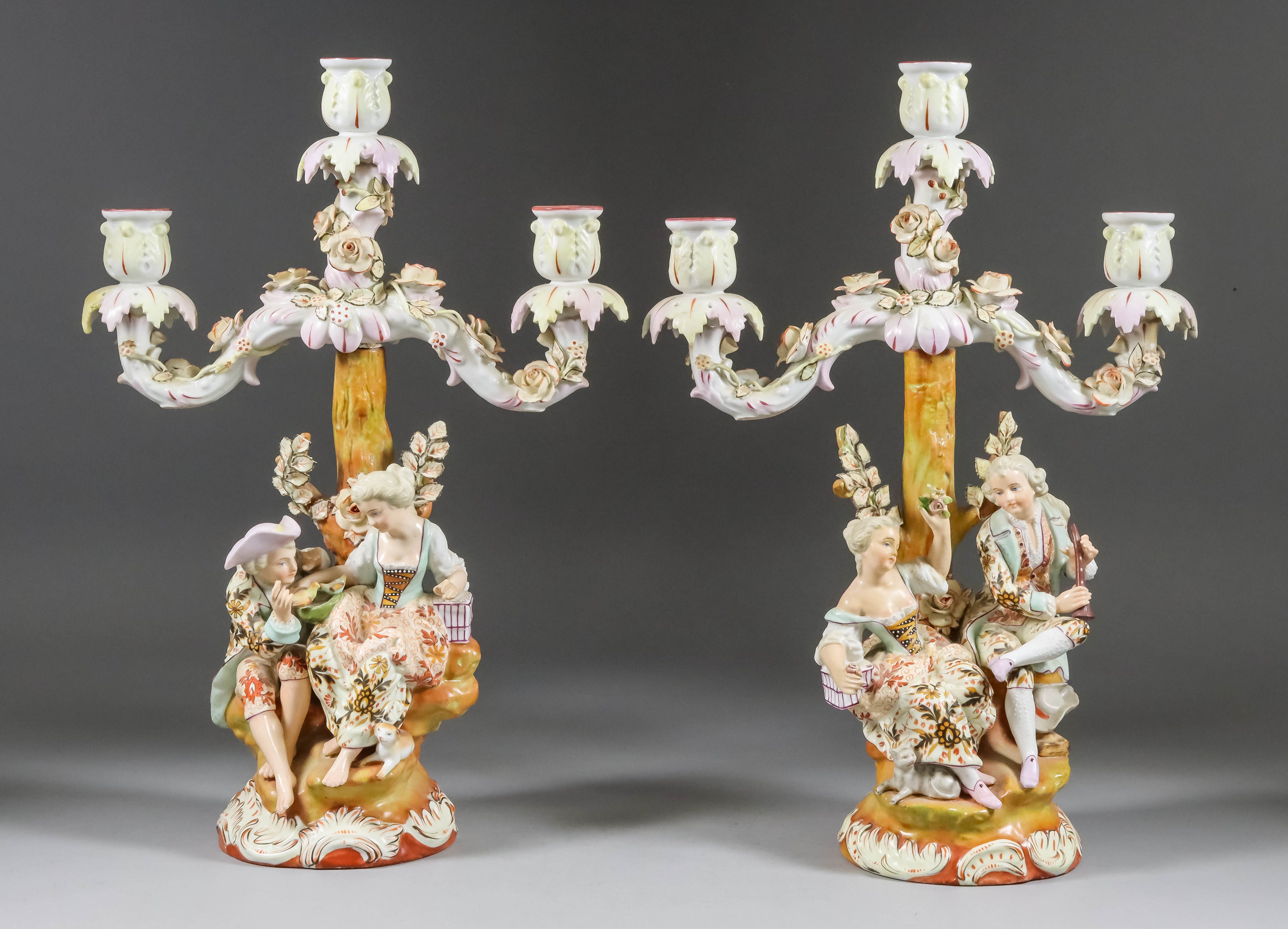 A Pair of Sitzendorf Porcelain Three-Branch Candelabra, Late 19th Century, modelled with cockerels