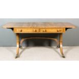 A George III Rosewood and Brass Inlaid Sofa Table, with figured veneered top and D-shaped flaps,
