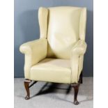 An Early 20th Century Stained Beechwood Wingback Easy Chair of "18th Century" design, with