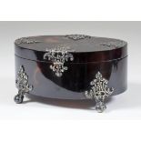 A Tortoiseshell and Silvery Metal Mounted Oval Box, the mounts pierced and cast with scroll