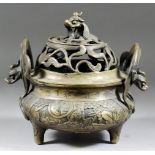 A Chinese Bronze Two-Handled Censer and Cover, 20th Century, the base cast with seated figures in