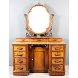 A Victorian Mahogany Kneehole Dressing Table, with rounded front corners and moulded edge to top,