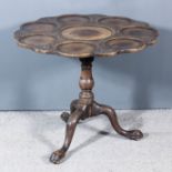 A Mahogany Circular Tripod Supper Table of George II Design, the tray top centre surrounded by seven