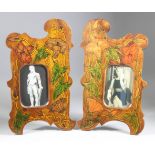 A Pair Of Wooden Photograph Frames, Early 20th Century, of shaped outline and painted in colours