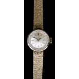 A Lady's Tissot Wristwatch, 9ct Gold Cased, the gilt dial with gold baton numerals, 17mm diameter,