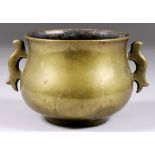 A Chinese Bronze Two-Handled Censer, the handles of stylised animal form, with cast six character