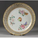A Chinese "Famille Rose" Porcelain Circular Dish, Qing Dynasty - Xianglong Period, with pierced