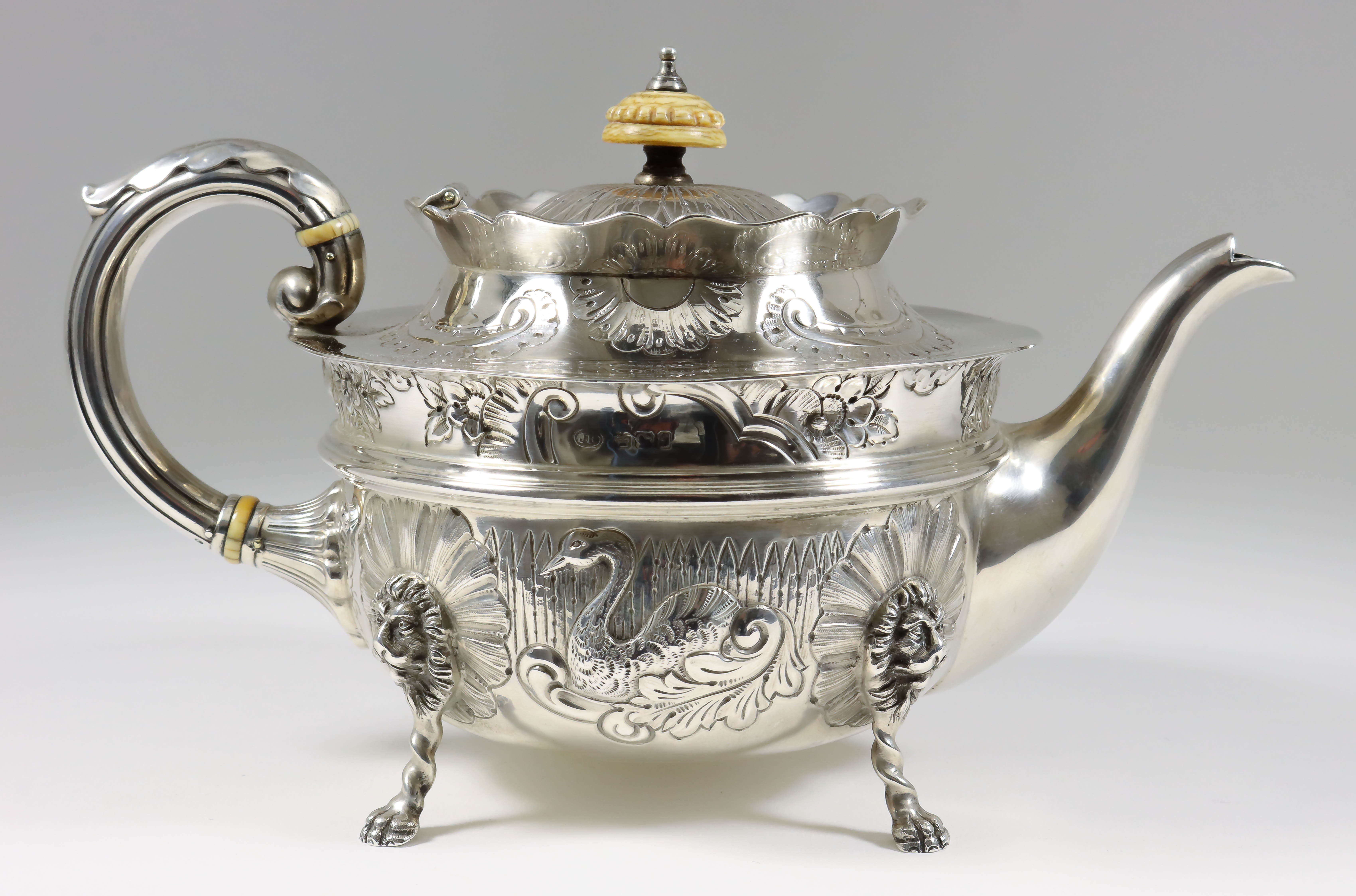 A Late Victorian Silver Circular Tea Pot, by John Round & Son Ltd, Sheffield 1898, with shaped rim