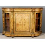 A Victorian Figured Walnut and Gilt Brass Mounted Credenza, with bowed ends, the whole with bead and