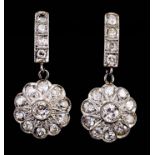 A Pair of All Diamond Flowerhead Pattern Drop Earrings, in 18ct gold mount, for pierced ears, the