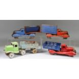 Four Tin Plate Truck Models, Circa 1940's, including covered flatbed truck with red cab, 11ins long
