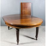 A Late Victorian Mahogany Circular Extending Dining Table, by Edwards & Roberts, with three extra