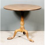 A George III "Cuban" Mahogany Circular Tripod Table, with plain one-piece top, on turned central